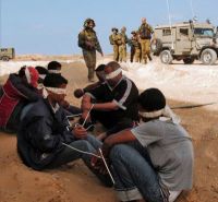 Israeli force raids unexpectedly cells of prisoners in Hadarim jail