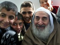 Palestinian young men recall childhood memories with Sheikh Yassin