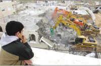 IOA hands 12 Palestinians in Al-Aghwar area demolition warnings