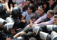 Security forces assault female activists, arresting 50 others